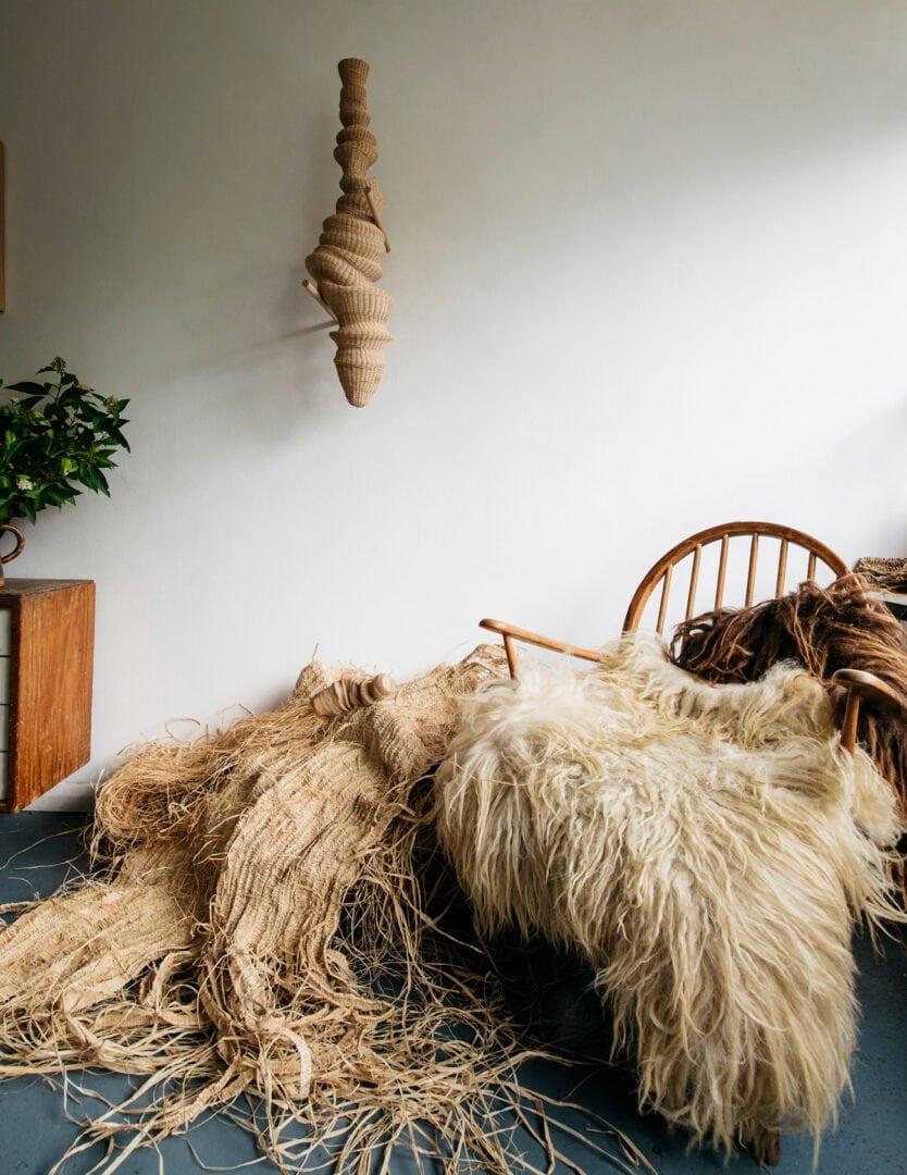 Woven chair with sheepskin and straw.