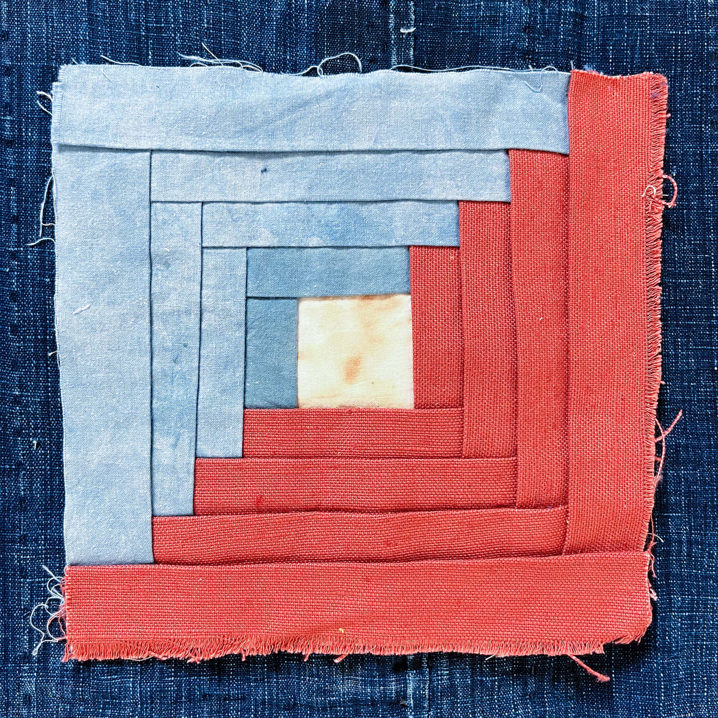 Red and blue patchwork fabric square.