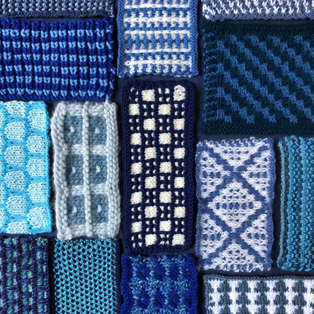 Knitted swatches in various blue patterns.