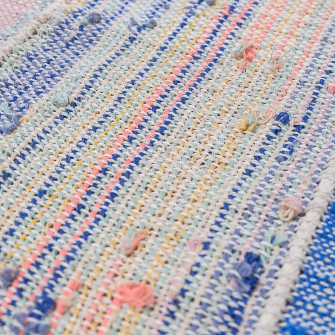 Close-up of woven colorful fabric.