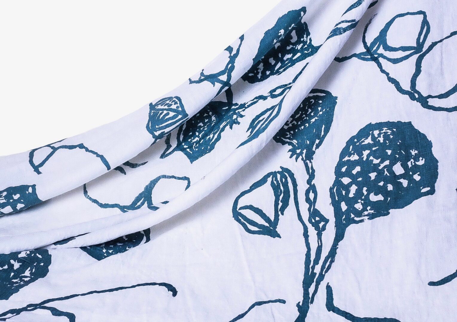 White fabric with blue floral print.