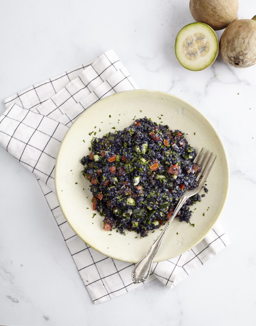 Black quinoa salad with tomato and cucumber.