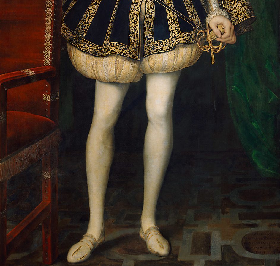 Man's legs in white tights and shoes.