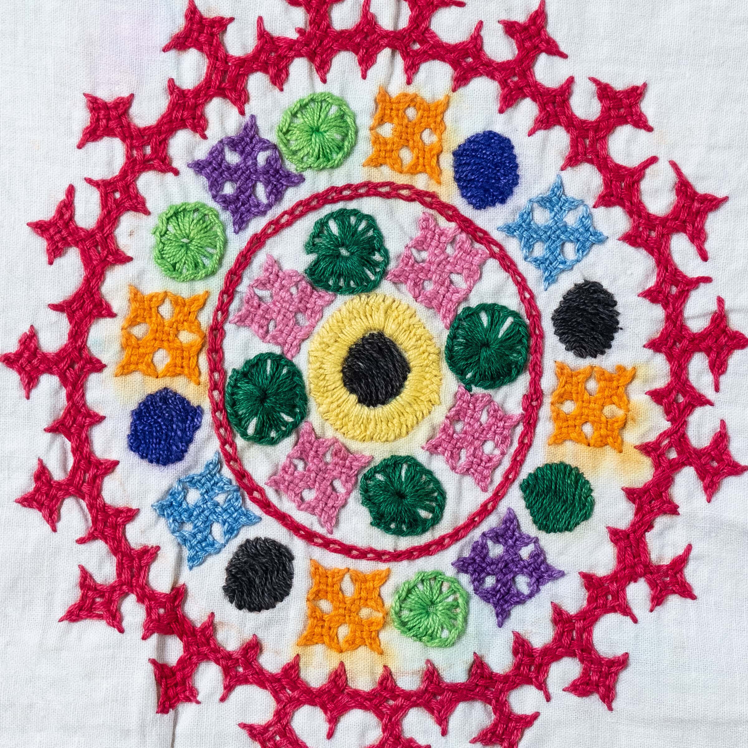 Colorful embroidered design on fabric.