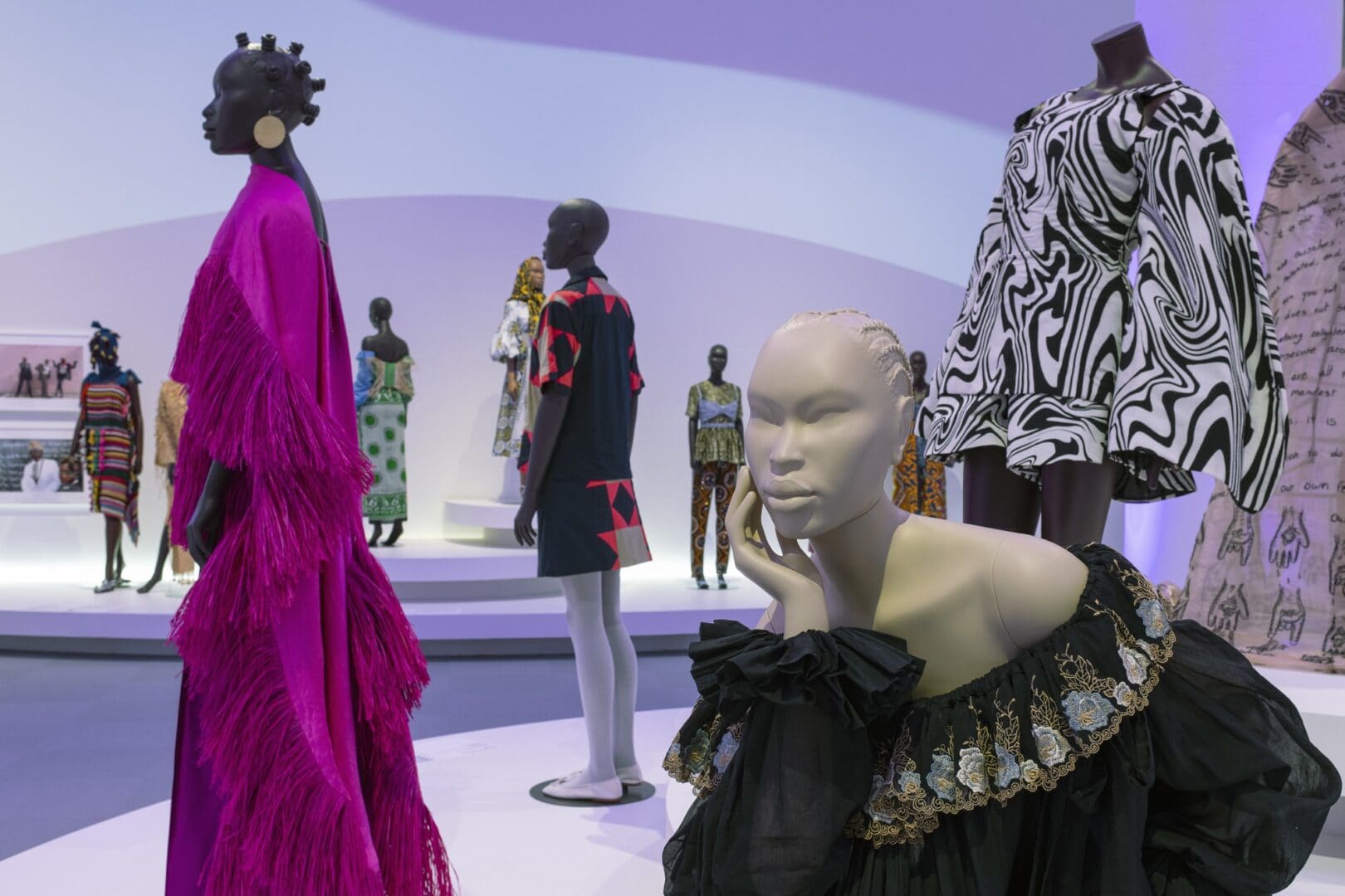 Mannequins wearing colorful and patterned clothing.