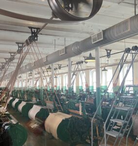 Vintage textile machinery in a factory.