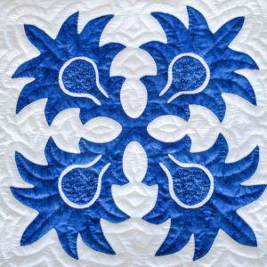 Blue and white quilted fabric design.