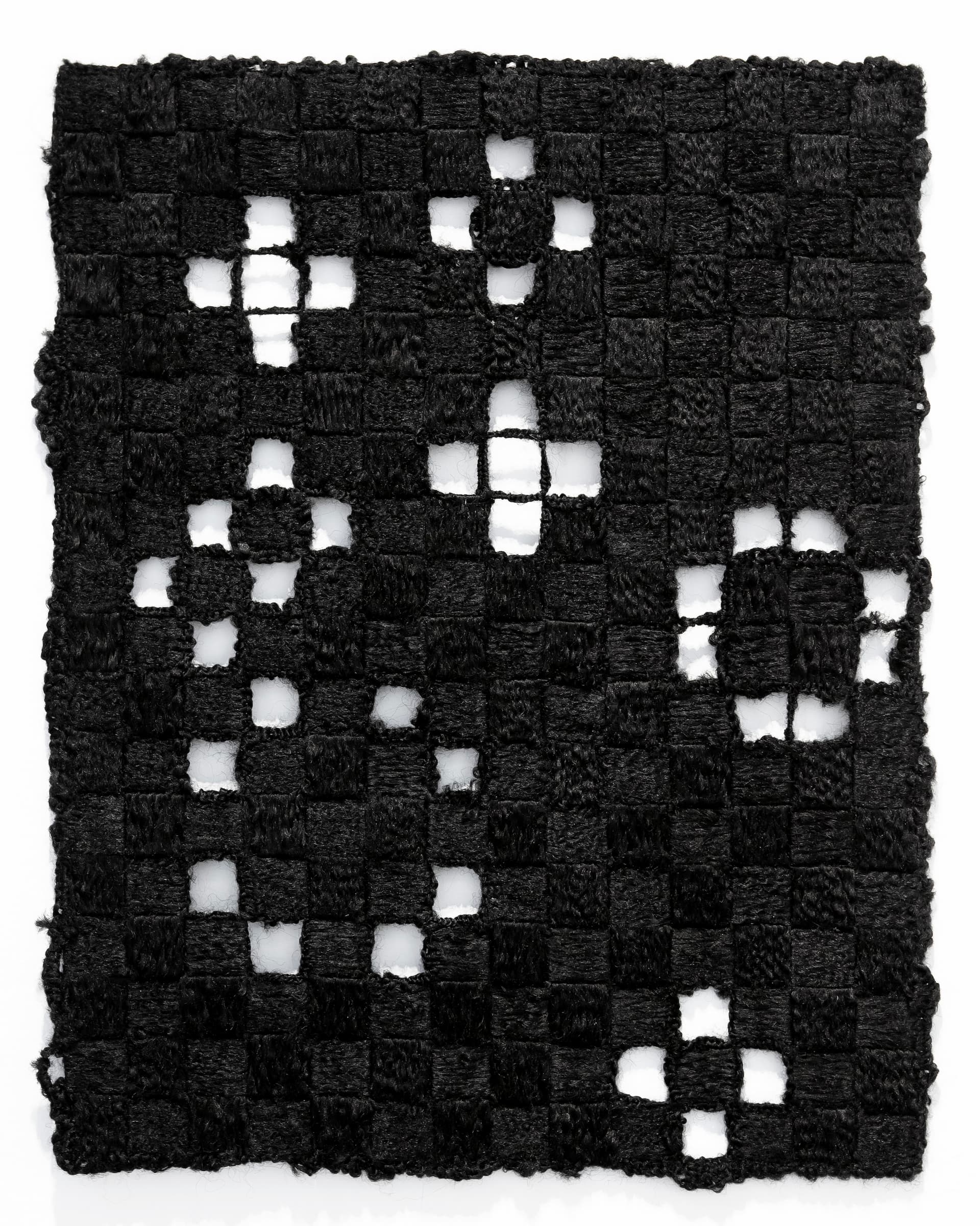 A weaving of black synthetic hair.
