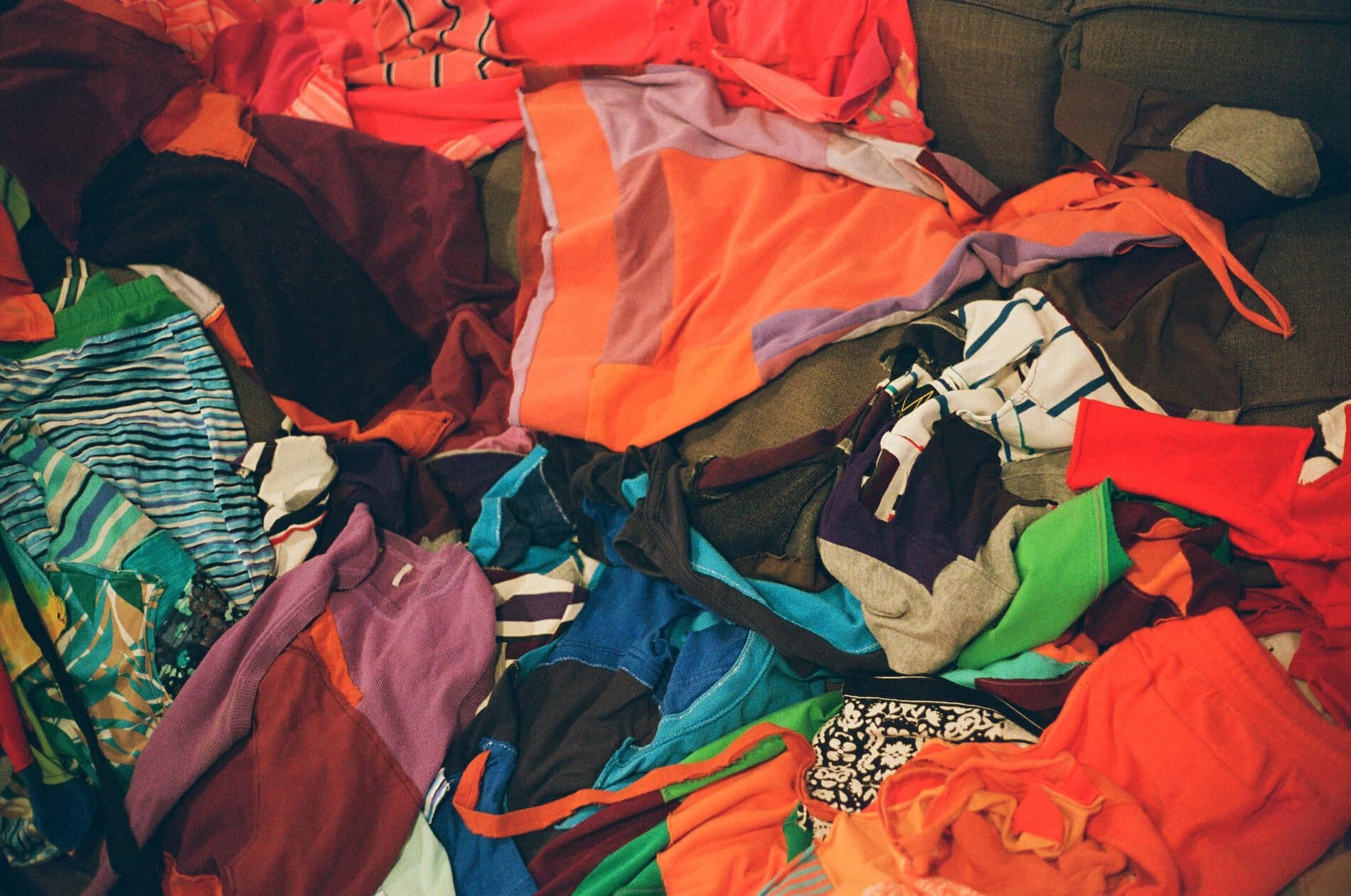 Colorful textile materials in a pile.
