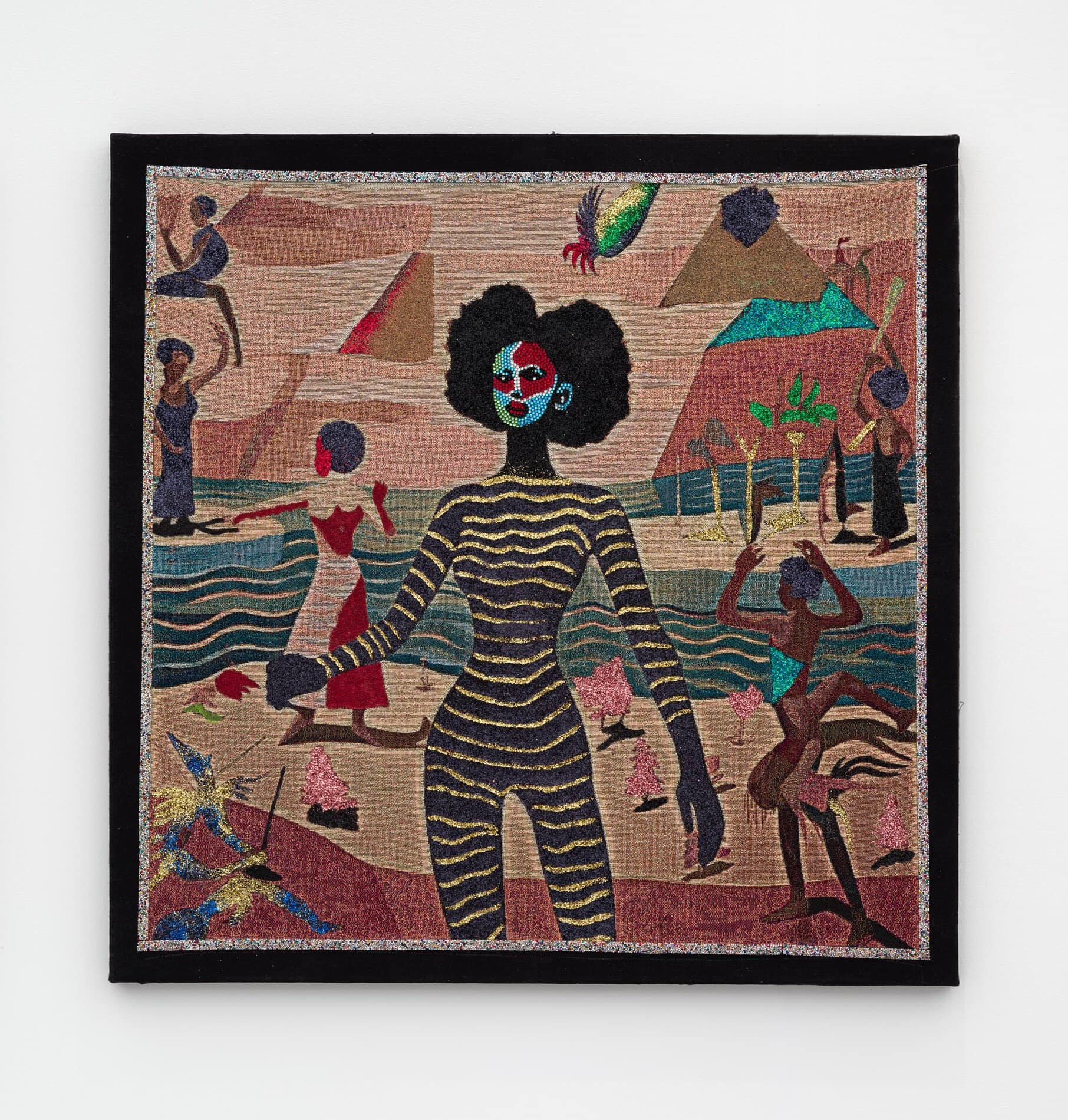 A tapestry depicting a Black woman with gold stripes across her body and green, white, blue and red jewels on her face, in front of smaller human figures scattered across a background of mountains and water.