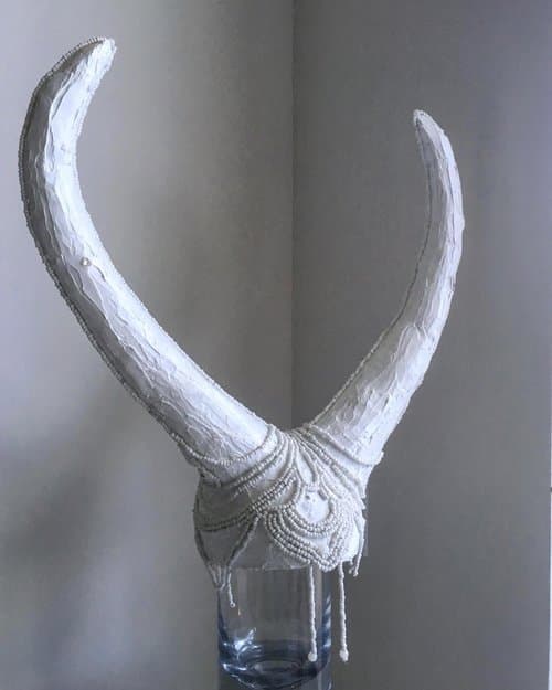 Beaded white horned headpiece.

