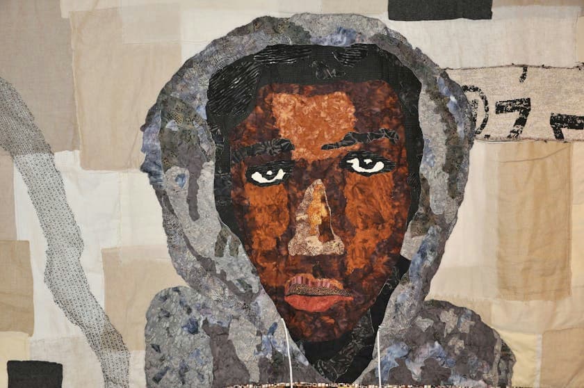 Quilted portrait of Trayvon Martin.
