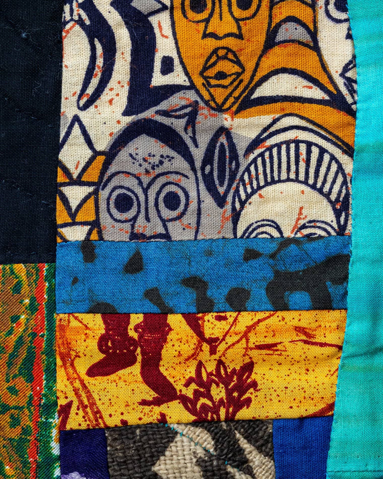 Detail of the many different patterned fabrics comprising the above quilt.
