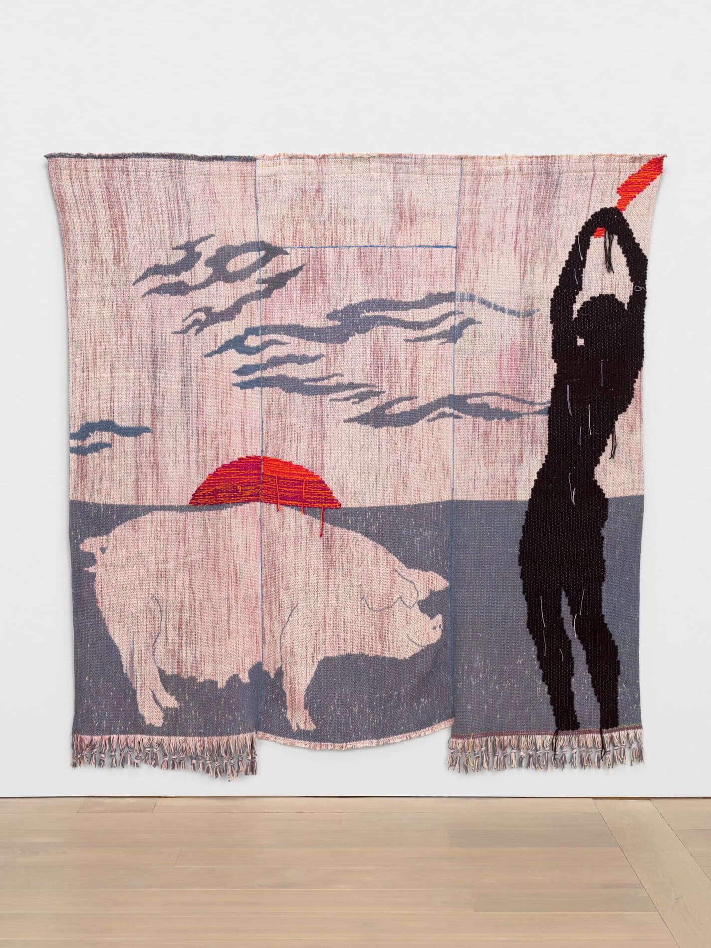 Weaving of a black figure raising a red knife next to a big against a gray and pink background with a red sun setting in the distance.
